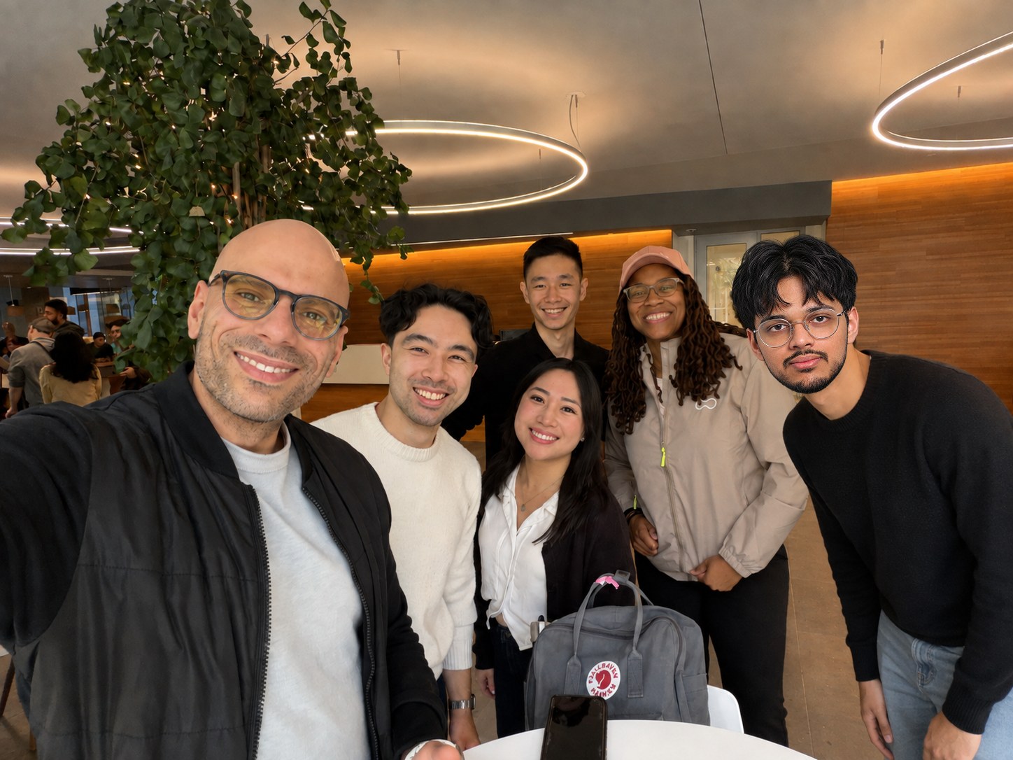 The Pactto team in the office, gathered around a table